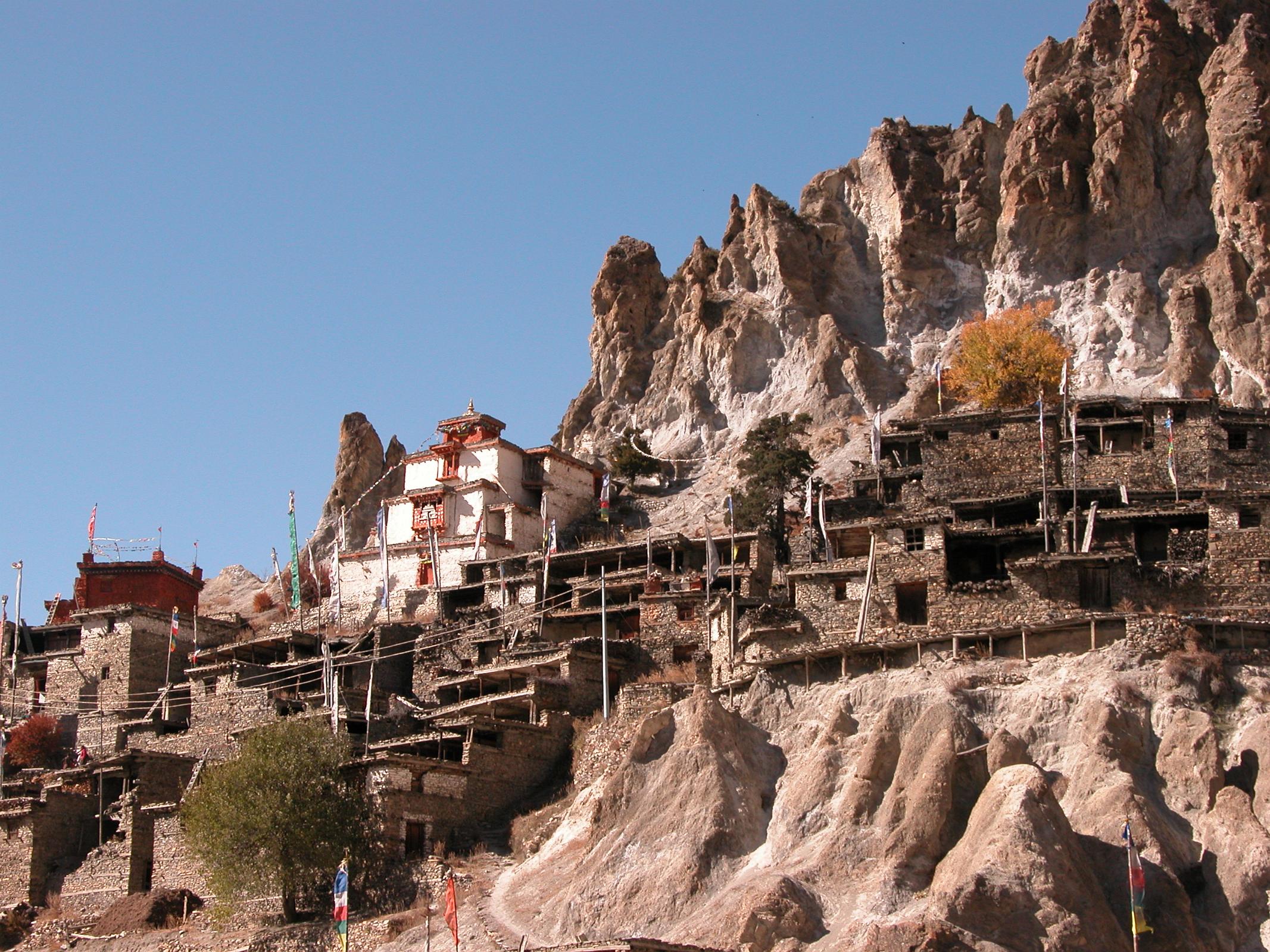 Annapurna 12 10 Braga Braga (3500m) is a Tibetan-style village of about 200 houses hiding behind a photogenic steep, eroded rock outcrop. The houses are stacked one atop the other, each with an open veranda formed by a neighbour�s rooftop. The gompa is perched on a high crag overlooking the village, and is estimated to be 400 to 500 years old. The gompa comprises three main buildings and belongs to the Kagyu sect of Tibetan Buddhism.